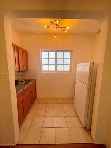 a view of a kitchen with a sink
