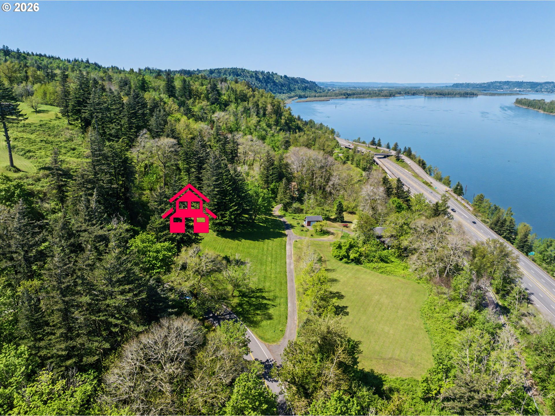 2445 Northeast Corbett Hill Road Corbett, OR 97019 - Photo 1 of 31 a view of a lake with a house