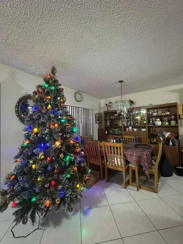 a kitchen with a stove a sink and a refrigerator