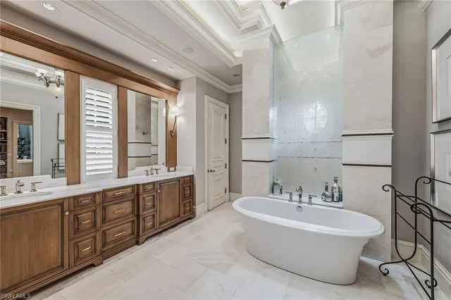 a living room with furniture and a book shelf