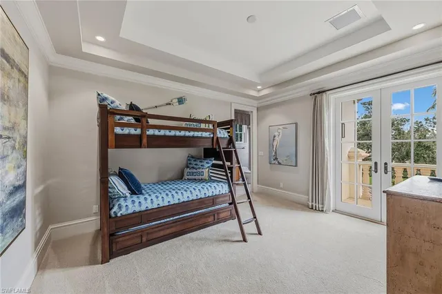 a bedroom with a bed couch and a window