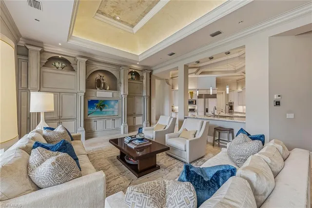 a living room with furniture and a clock