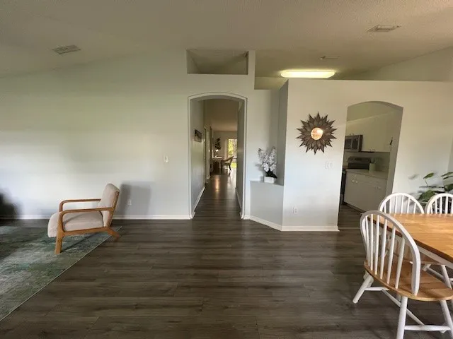 a view of a livingroom with furniture and wooden floor