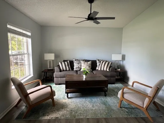 a living room with furniture and a window