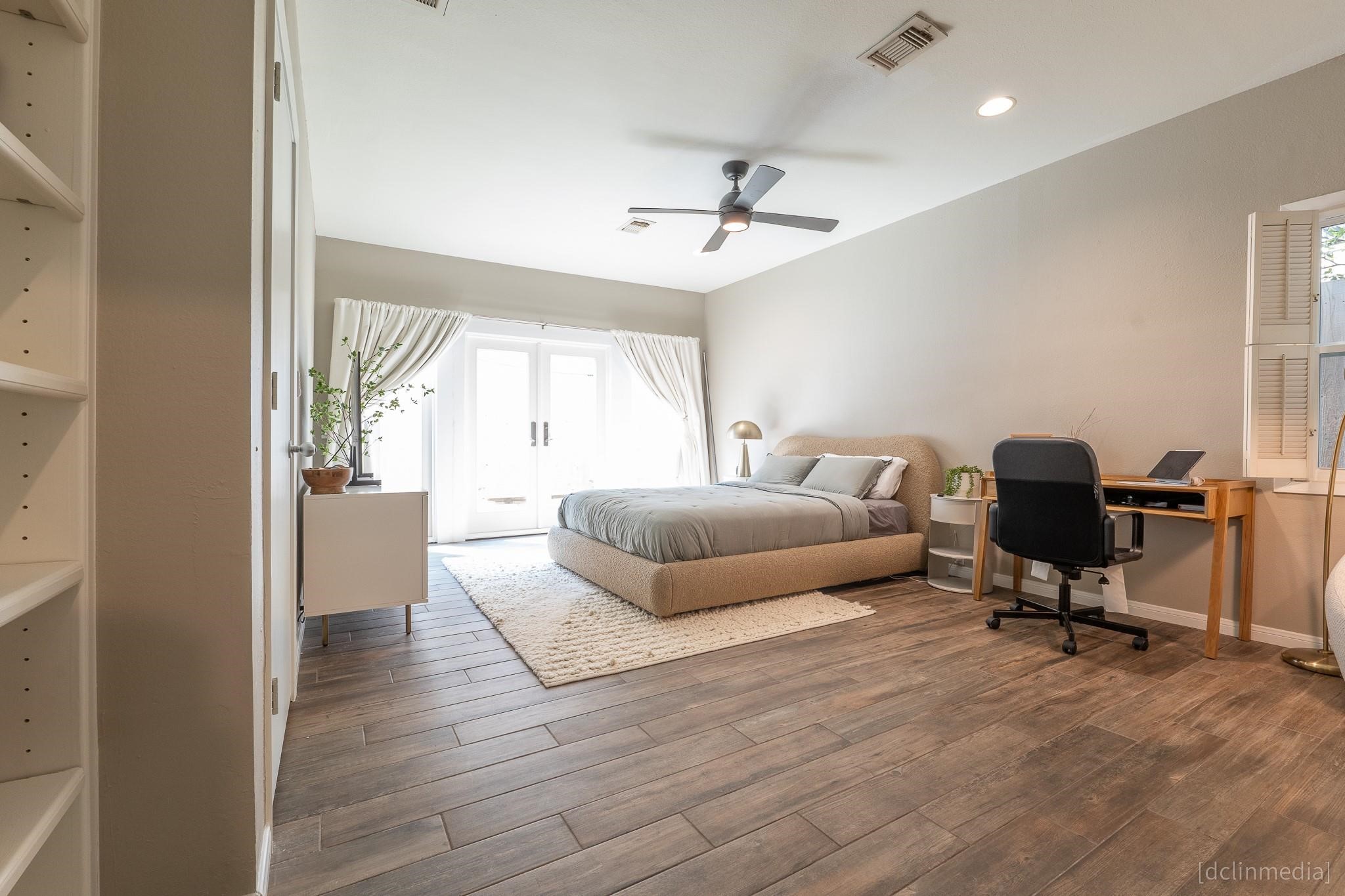 2002 Norfolk Street, Unit A Houston, TX 77098 - Photo 22 of 35 a bedroom with a bed and furniture