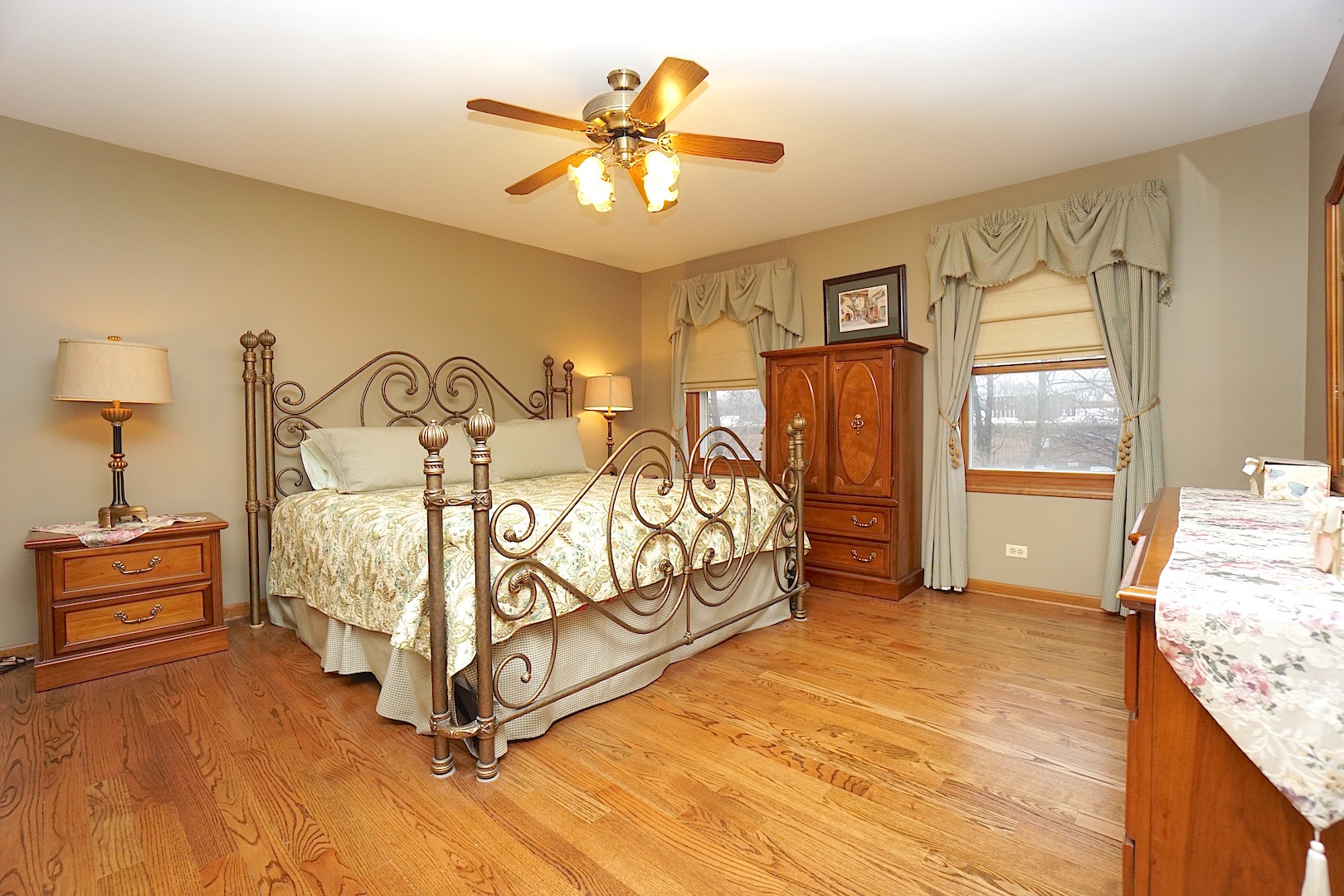 1611 Canyon Run Road Naperville, IL 60565 - Photo 14 of 23 a bed room with a bed and a chandelier