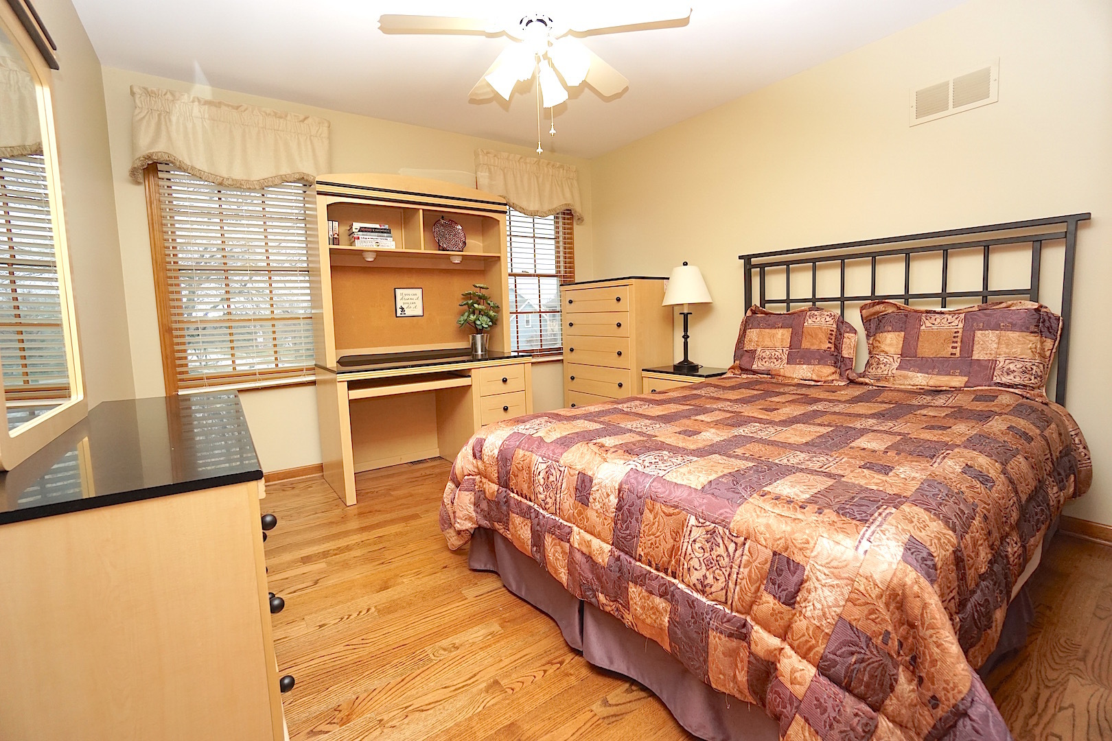 1611 Canyon Run Road Naperville, IL 60565 - Photo 17 of 23 a bedroom with a bed and window