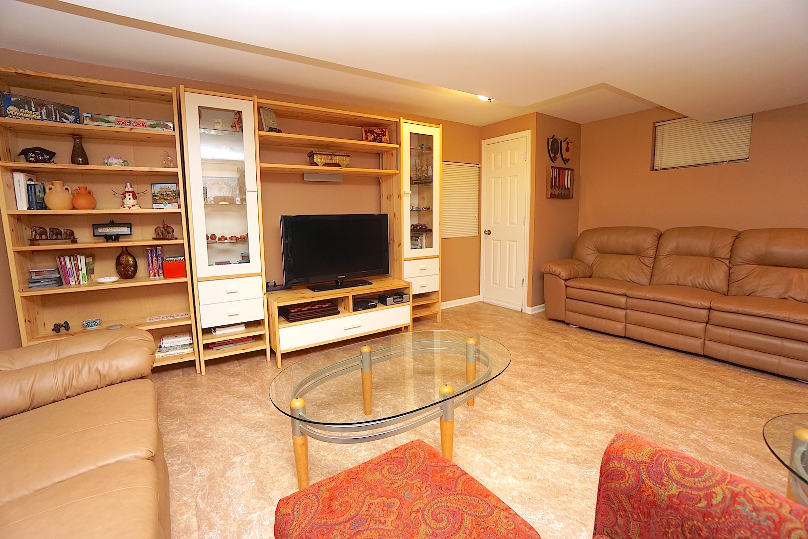 1611 Canyon Run Road Naperville, IL 60565 - Photo 20 of 23 a living room with furniture and a flat screen tv