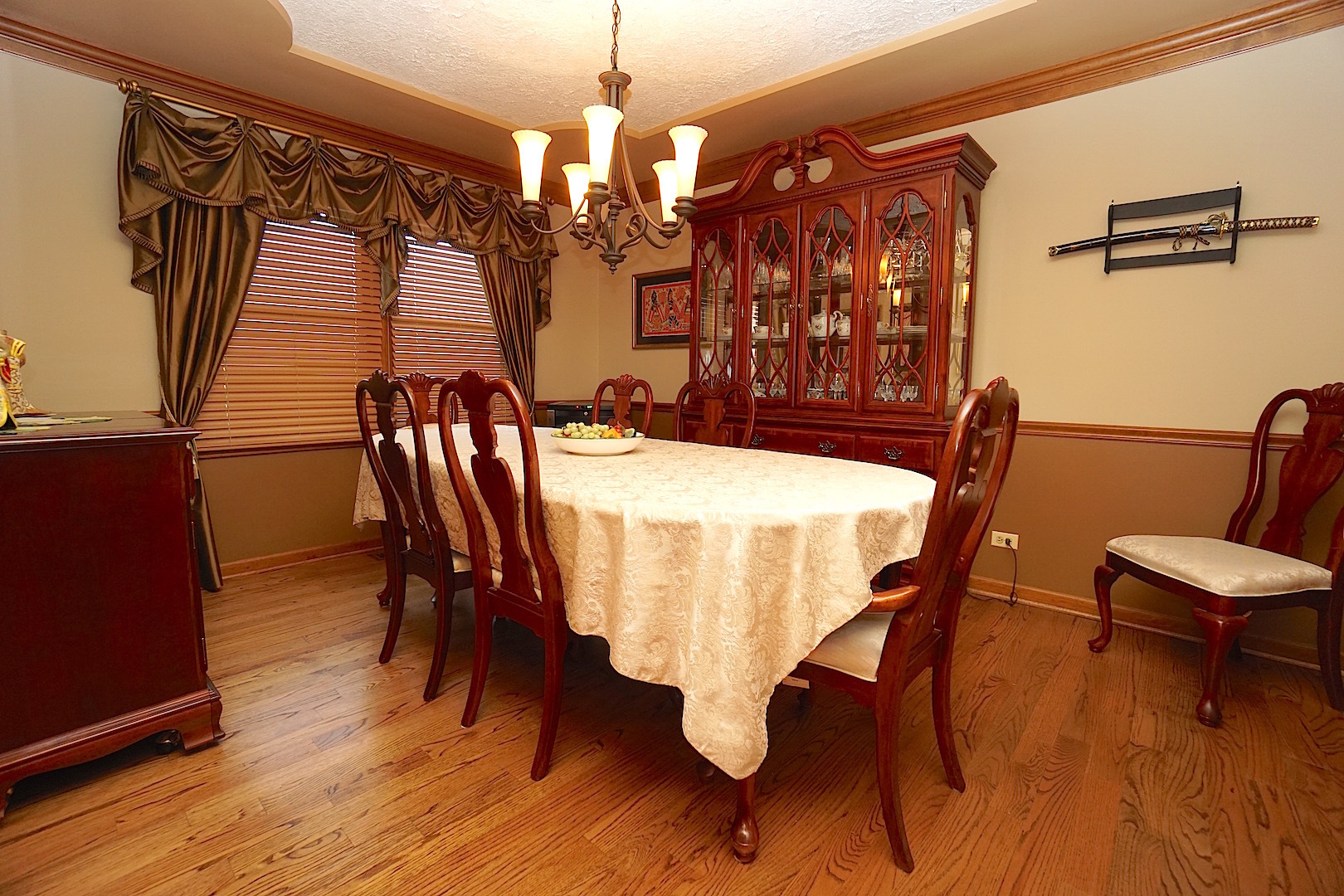 1611 Canyon Run Road Naperville, IL 60565 - Photo 6 of 23 a view of a dining room with furniture and wooden floor