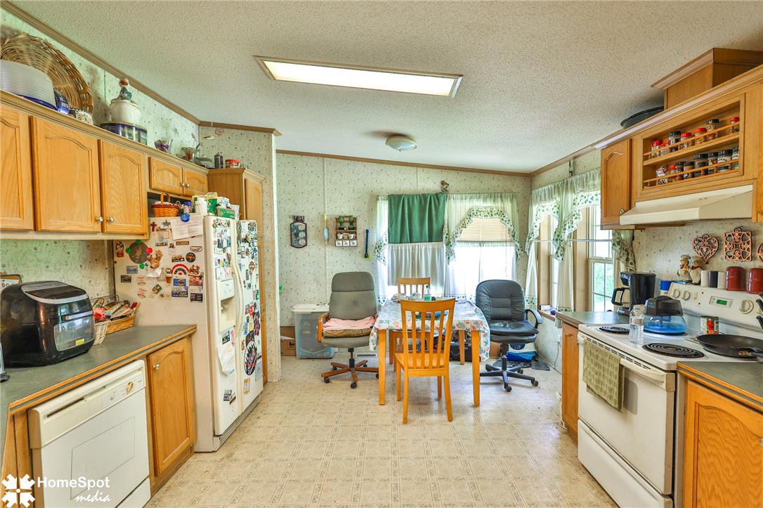 3795 Rhoades Road Kempton, PA 19529 - Photo 32 of 42 A well-lit kitchen with ample cabinet space and functional appliances.