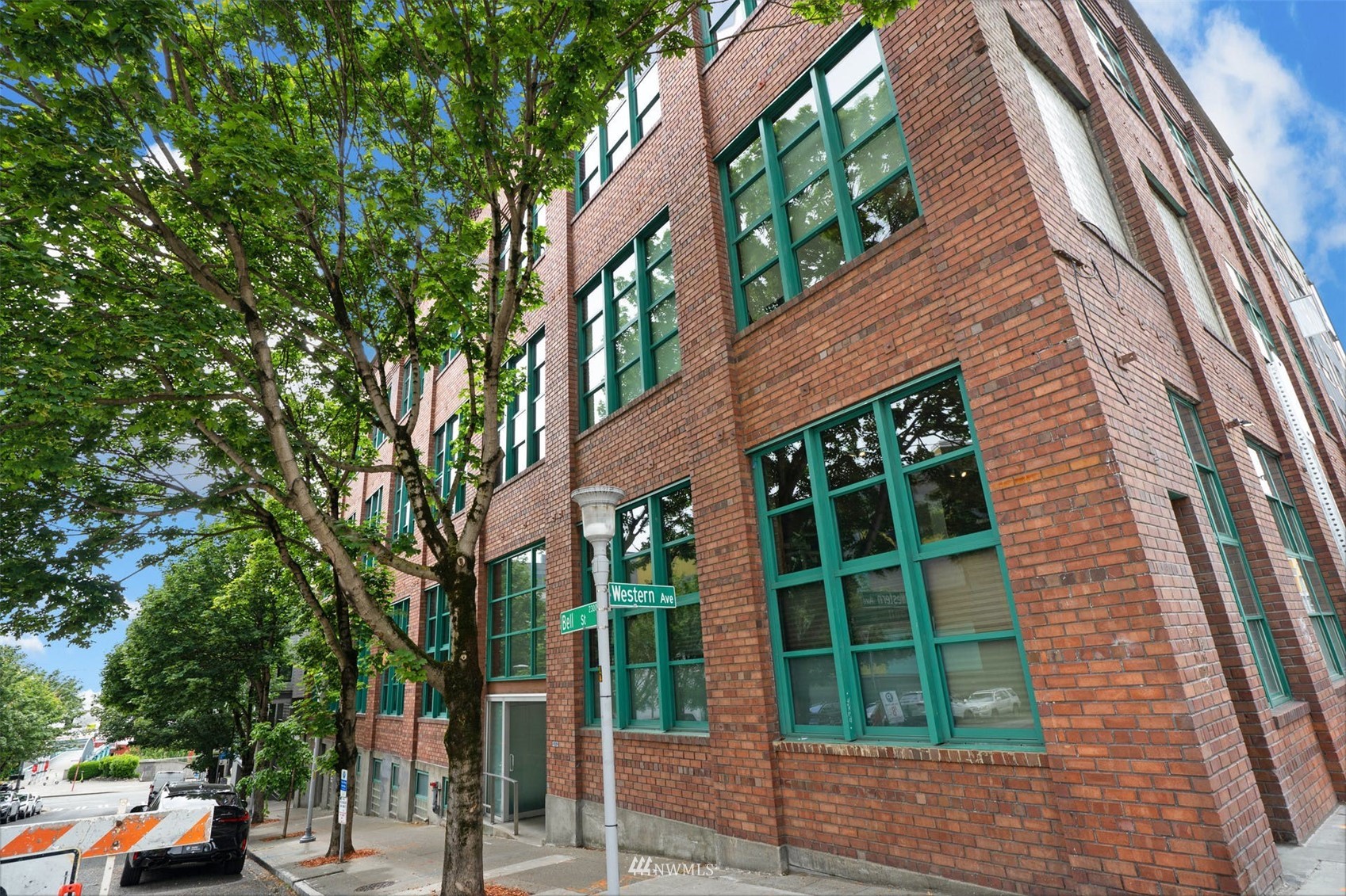66 Bell Street, Unit 203 Seattle, WA 98121 - Photo 1 of 35 a view of a house with a tree