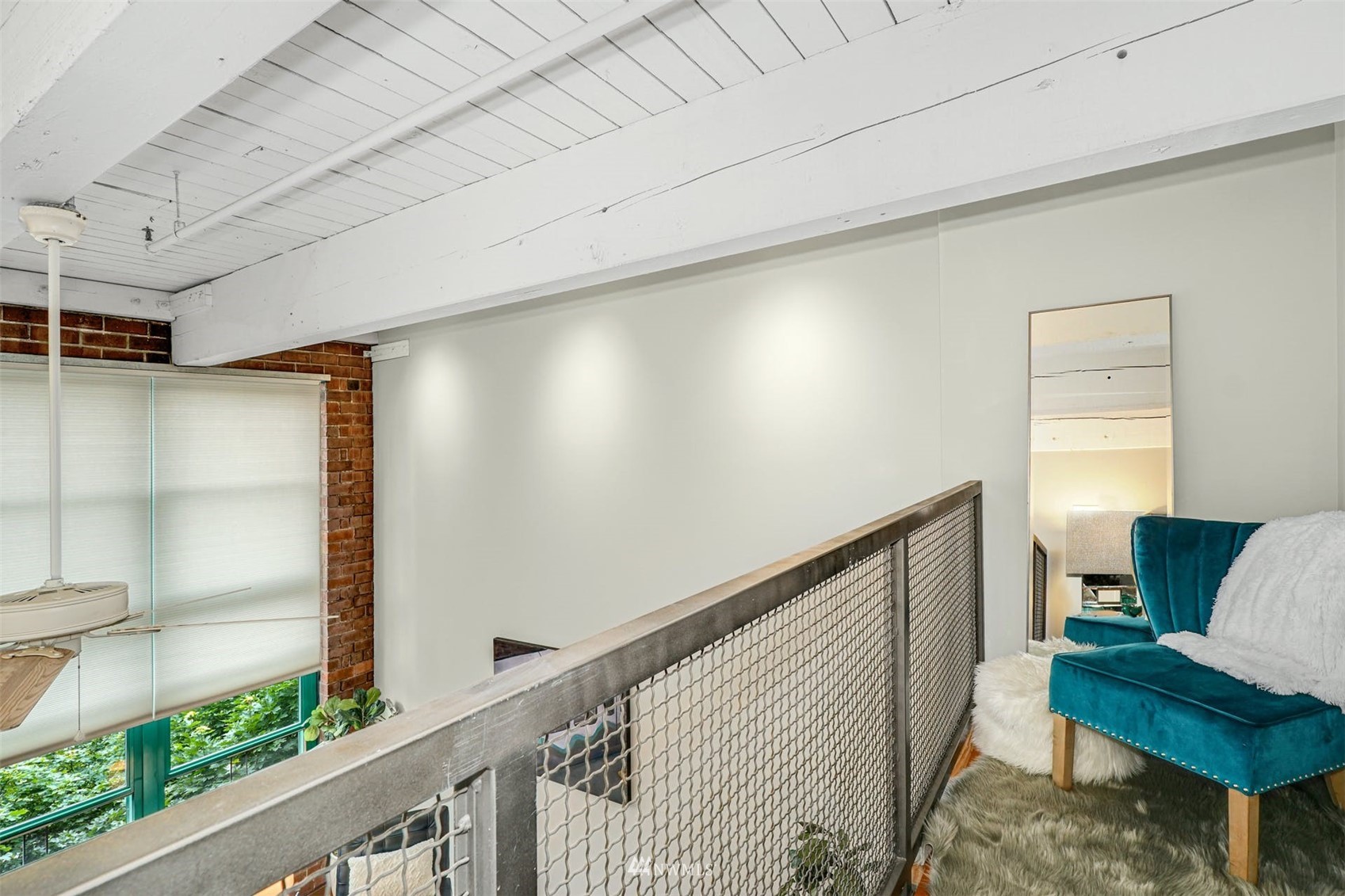 66 Bell Street, Unit 203 Seattle, WA 98121 - Photo 24 of 35 a view of an empty room and wooden floor