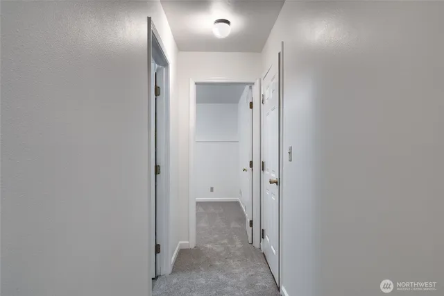 a view of hallway with a mirror