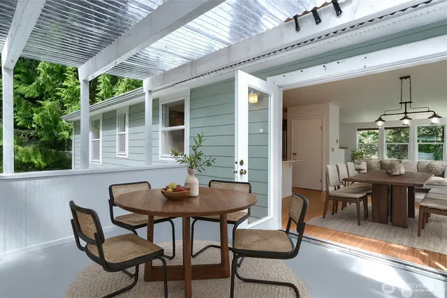 a view of a dining room with furniture window and outside view