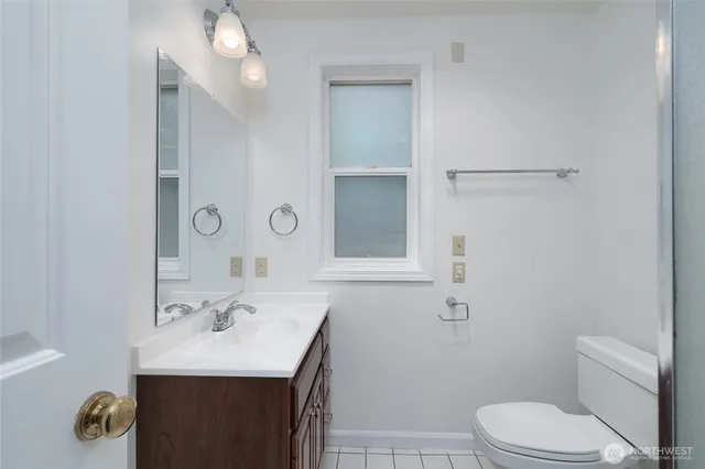 a bathroom with a sink toilet and vanity