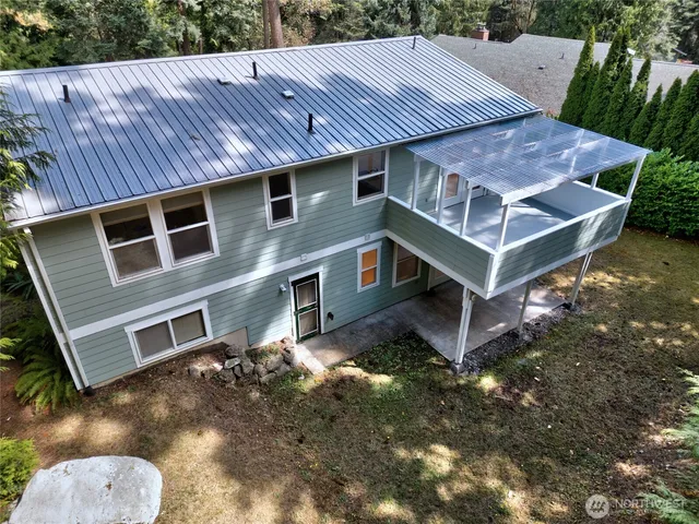 a aerial view of a house with a yard