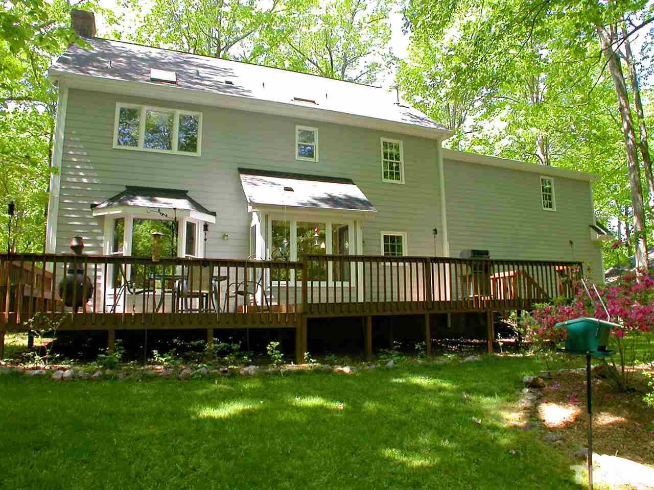11812 Mountbatten Way Raleigh, NC 27613 - Photo 22 of 25 a view of a deck with a table and chair swing