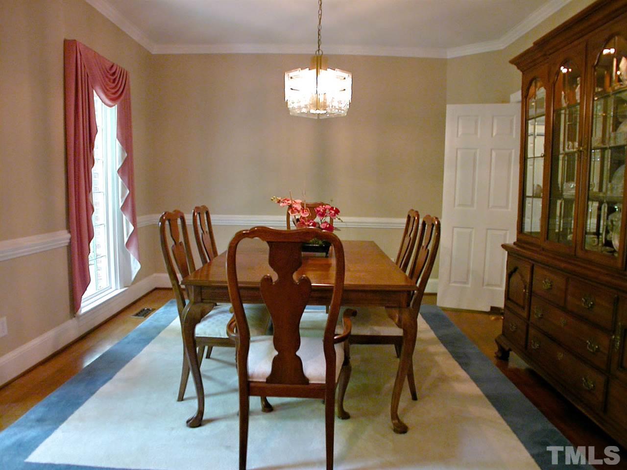 11812 Mountbatten Way Raleigh, NC 27613 - Photo 4 of 25 a view of a dining room with furniture and window