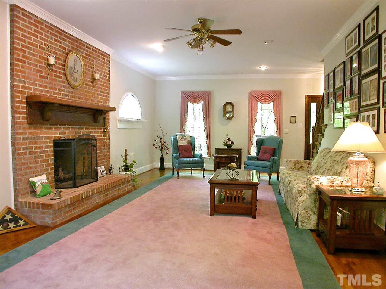 11812 Mountbatten Way Raleigh, NC 27613 - Photo 5 of 25 a living room with furniture and a fireplace