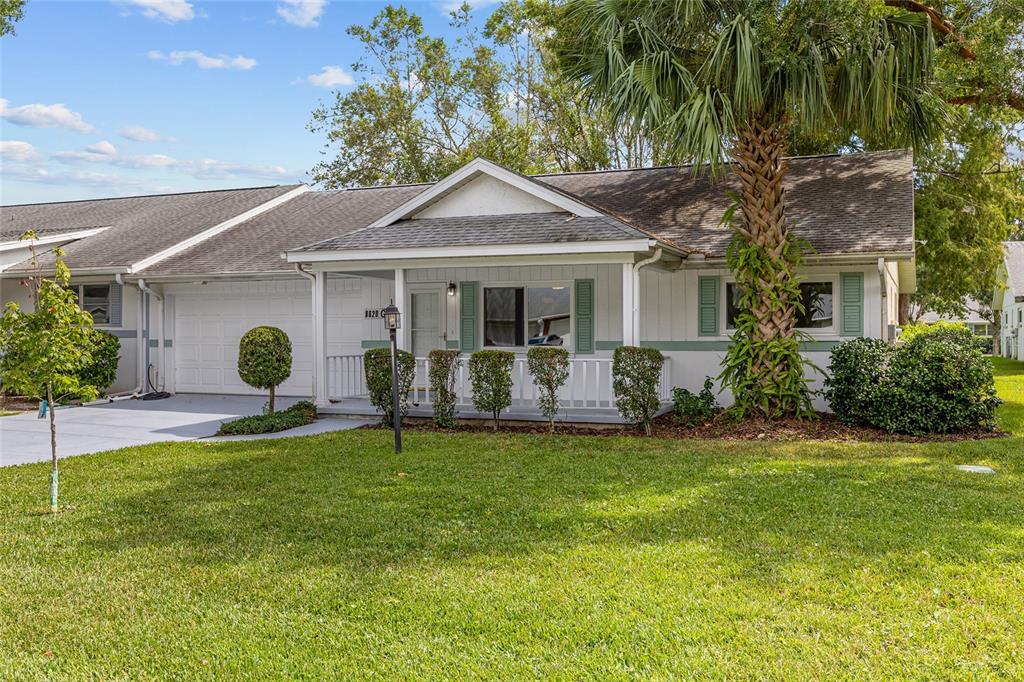8620 Southwest 94 Street, Unit G Ocala, FL 34481 - Photo 1 of 1 a front view of house with yard and green space