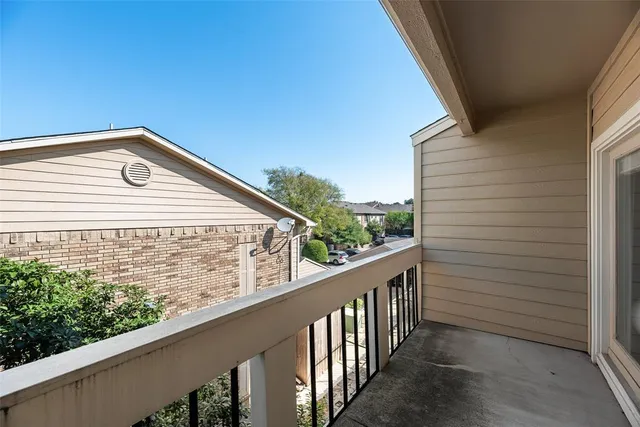 a view of a balcony with an outdoor space