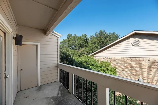 a view of a balcony with an outdoor space