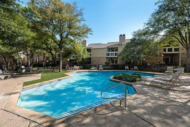 a view of a backyard with a sitting area