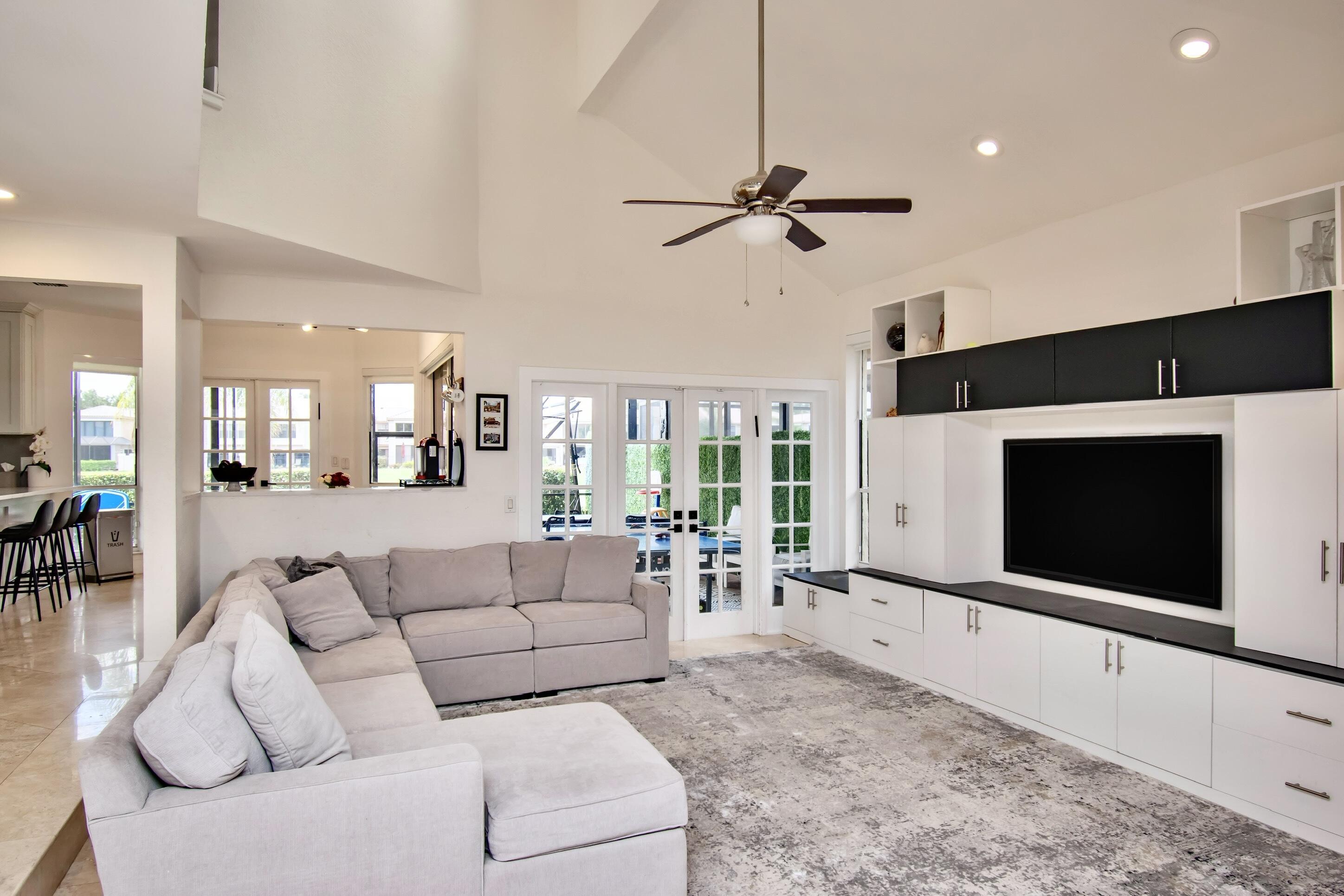 22568 Esplanada Circle Boca Raton, FL 33433 - Photo 12 of 50 a living room with furniture a flat screen tv and a fireplace