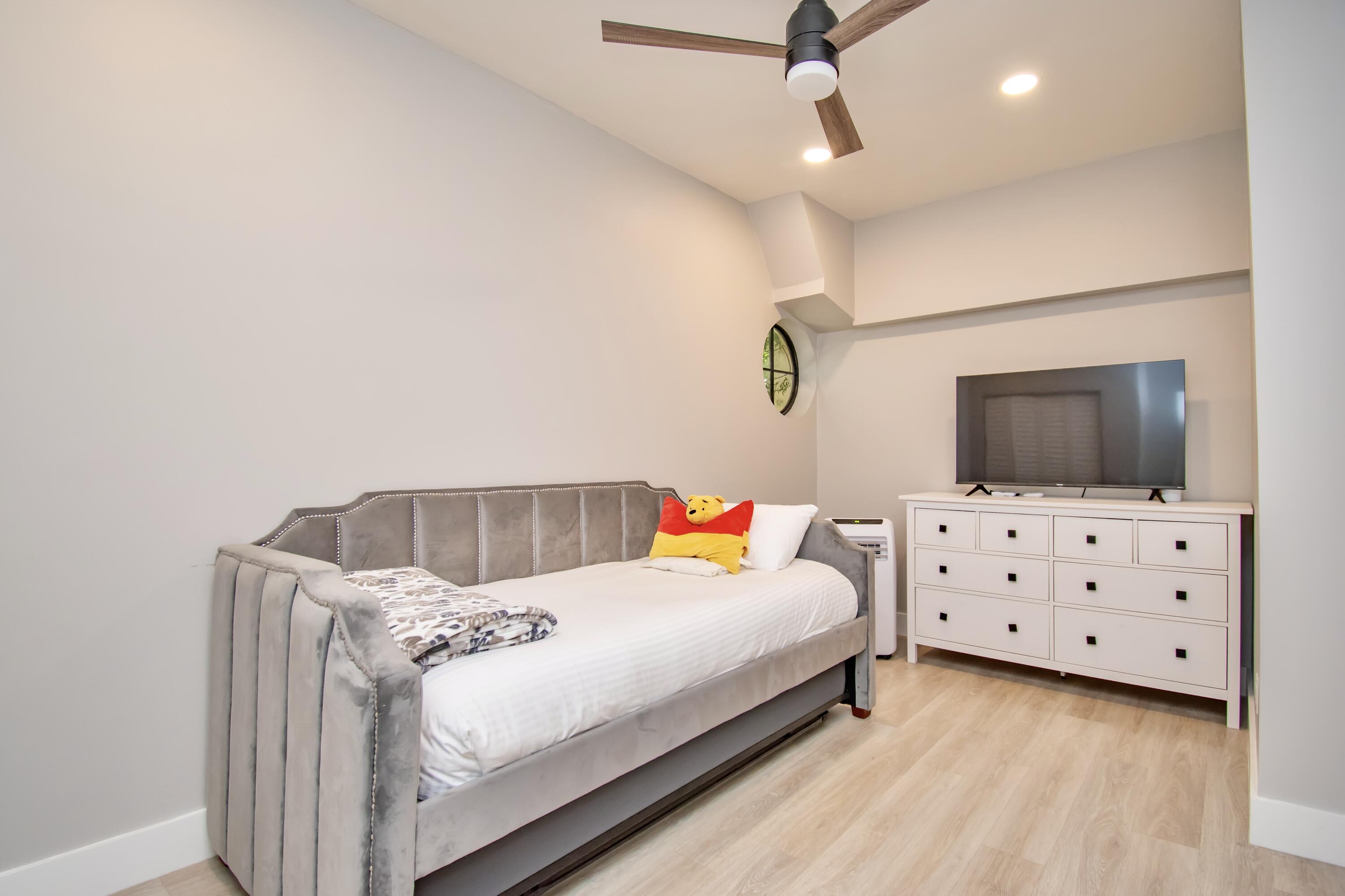 22568 Esplanada Circle Boca Raton, FL 33433 - Photo 20 of 50 a bedroom with a bed and a flat screen tv