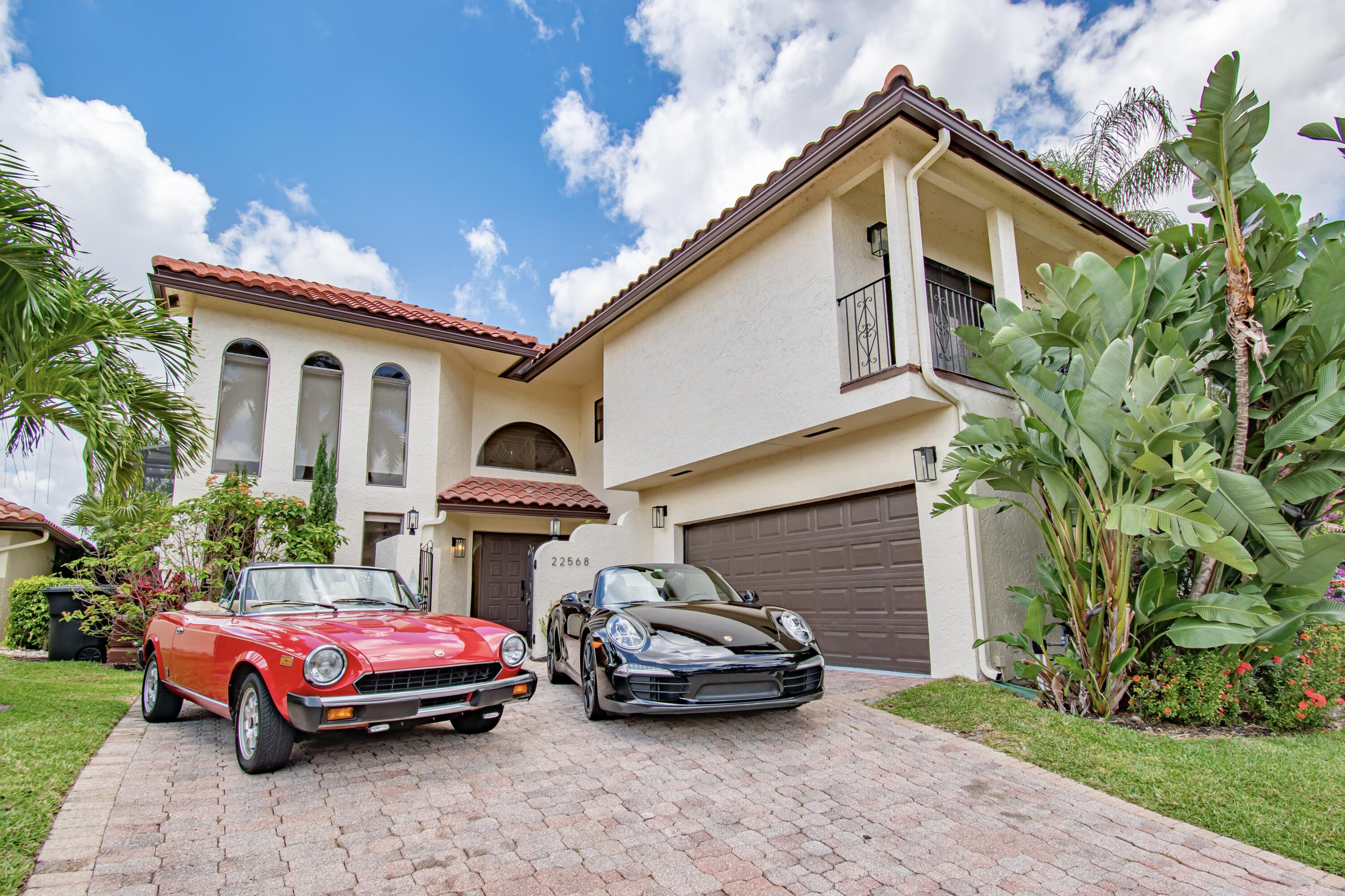 22568 Esplanada Circle Boca Raton, FL 33433 - Photo 2 of 50 a car parked in front of a house