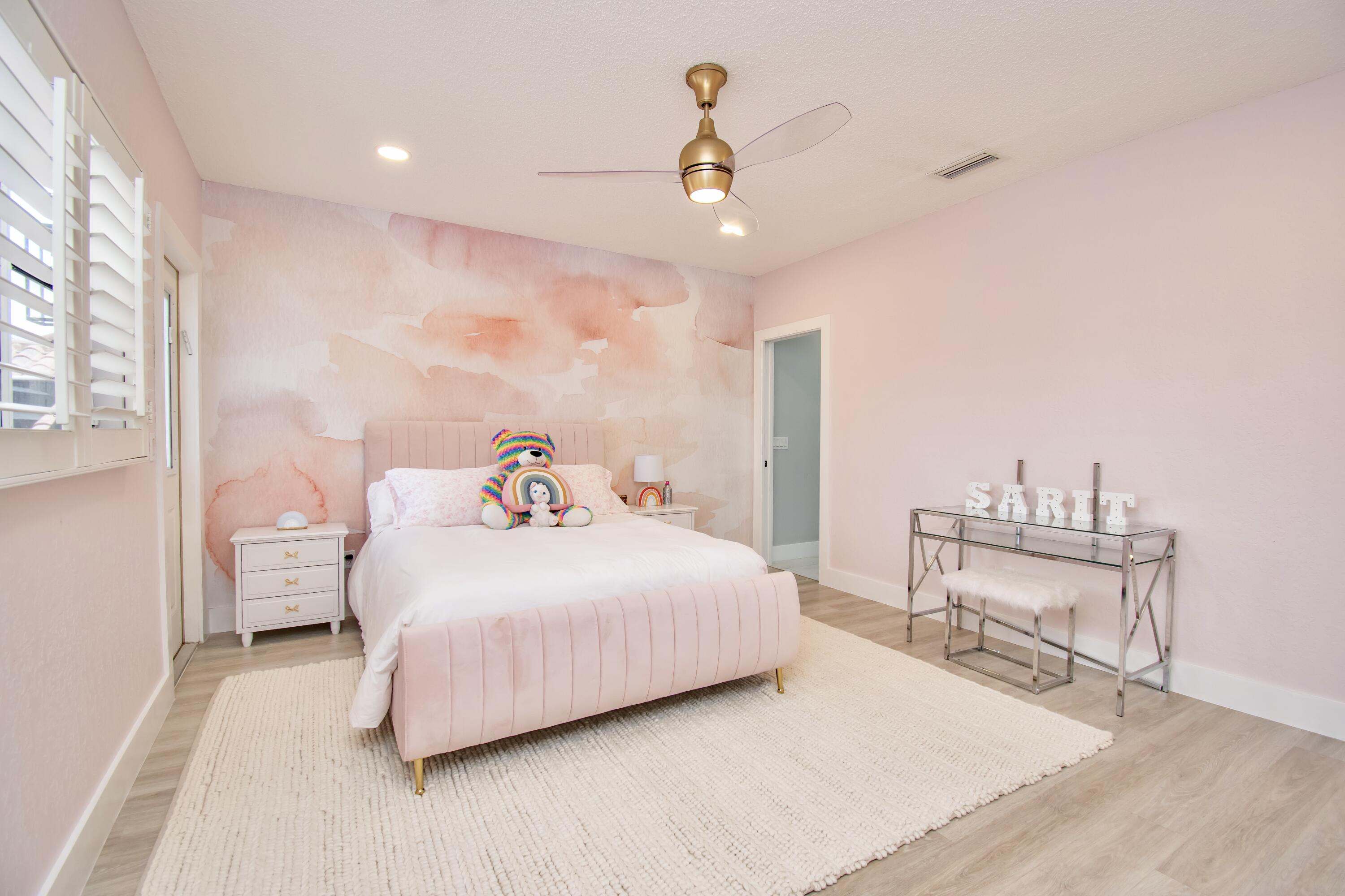 22568 Esplanada Circle Boca Raton, FL 33433 - Photo 28 of 50 a bedroom with a bed a chair and potted plant with the wooden floor