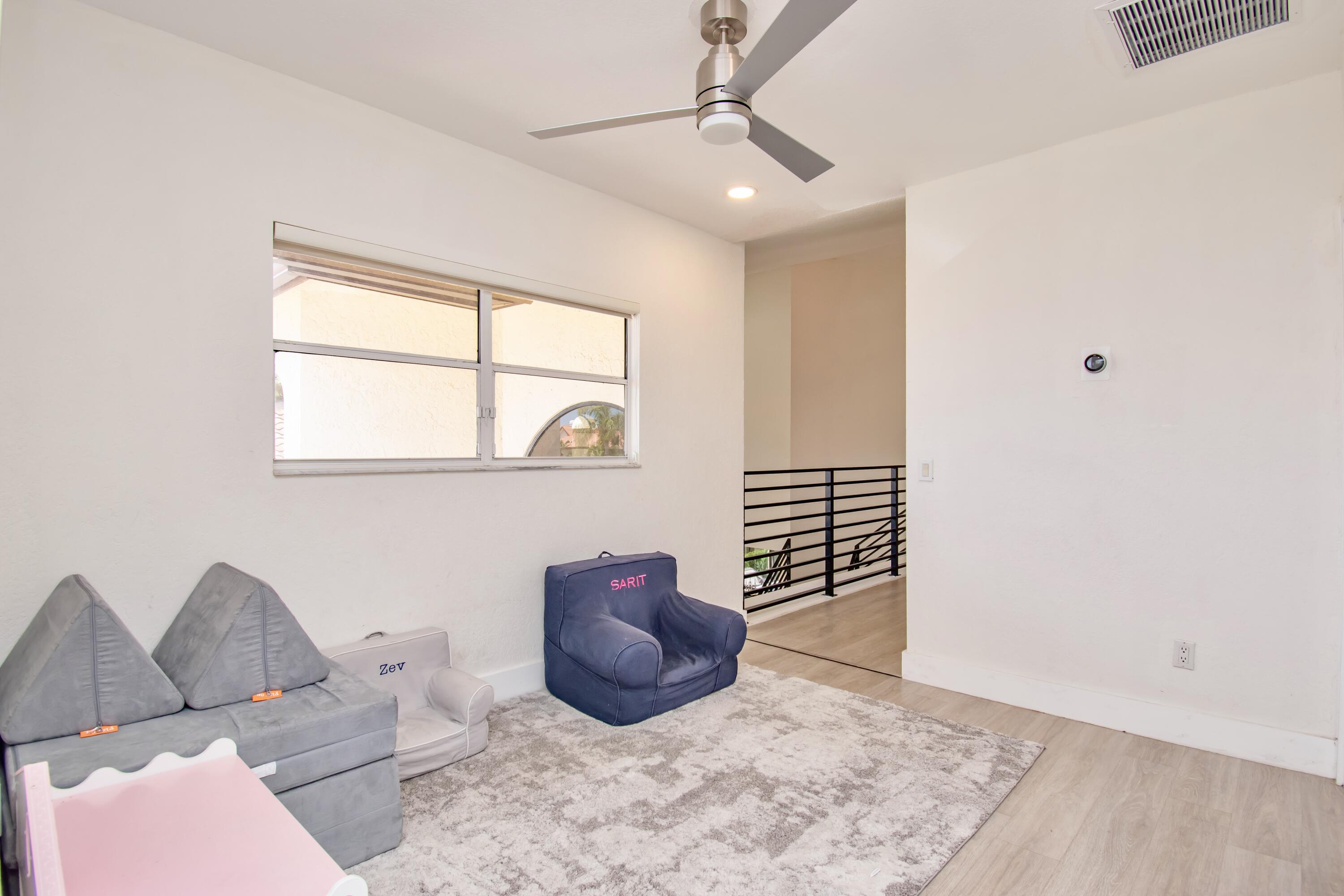 22568 Esplanada Circle Boca Raton, FL 33433 - Photo 31 of 50 a living room with furniture and a window