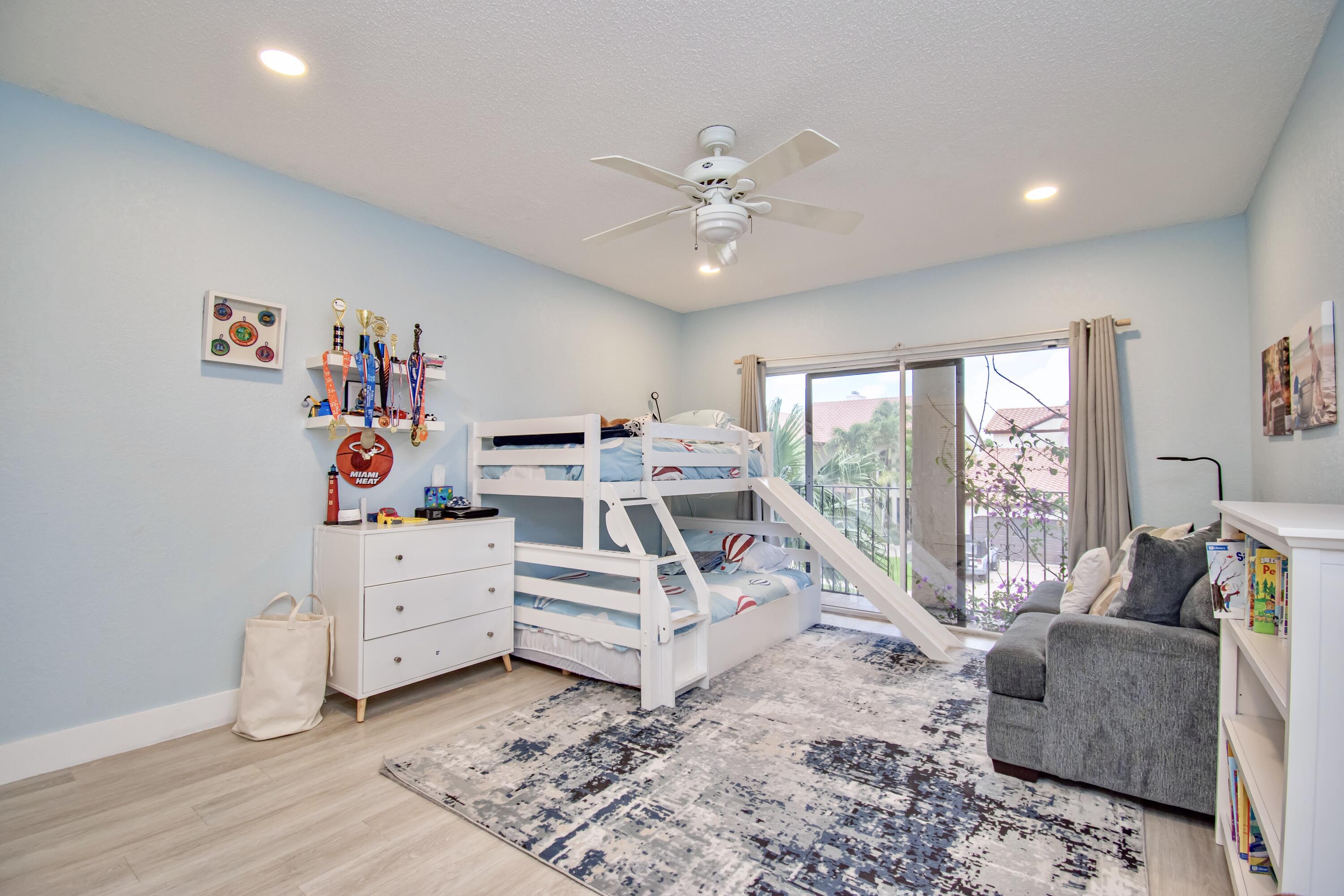 22568 Esplanada Circle Boca Raton, FL 33433 - Photo 35 of 50 a bed room with furniture and a large window