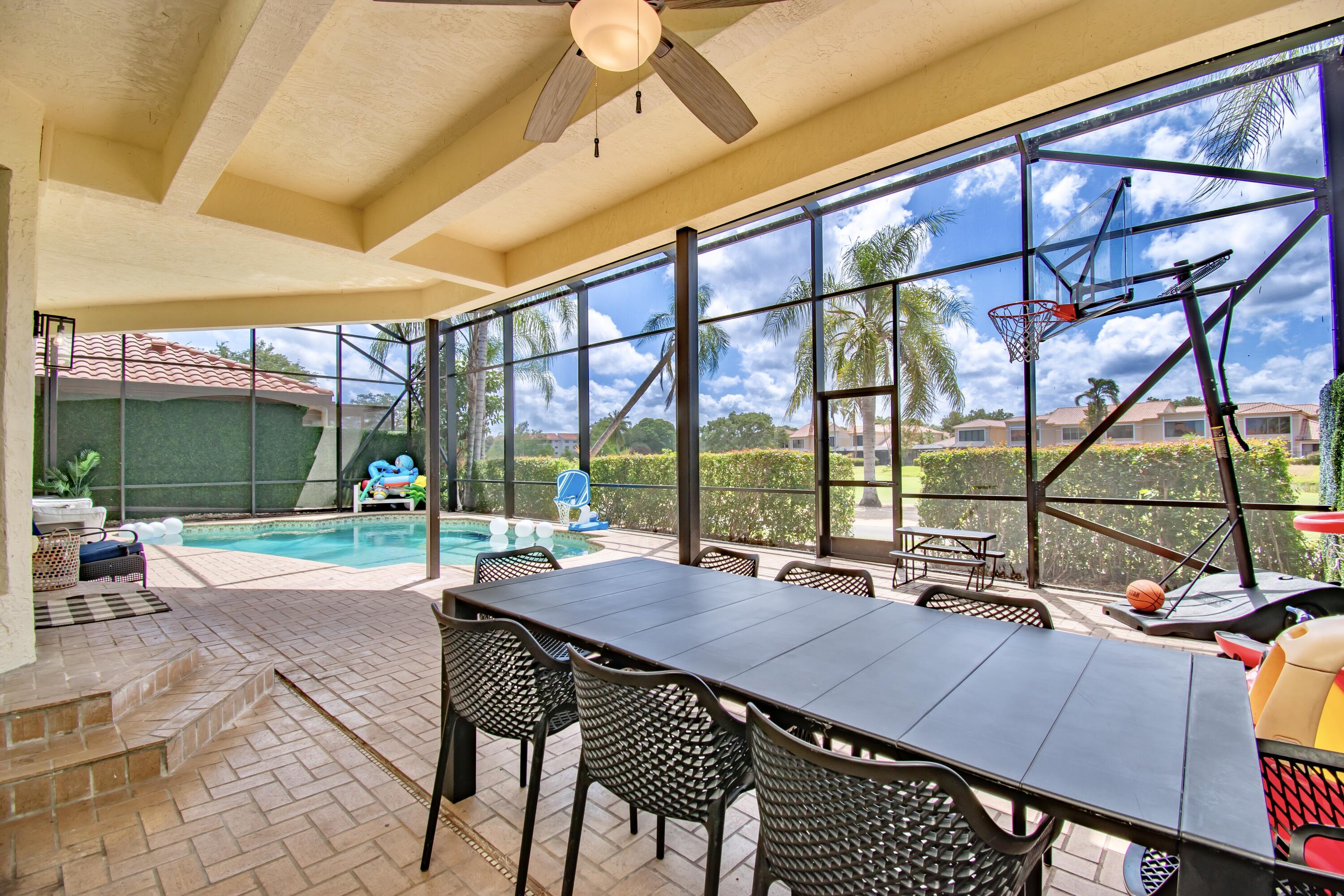 22568 Esplanada Circle Boca Raton, FL 33433 - Photo 37 of 50 a view of a patio with a table and chairs