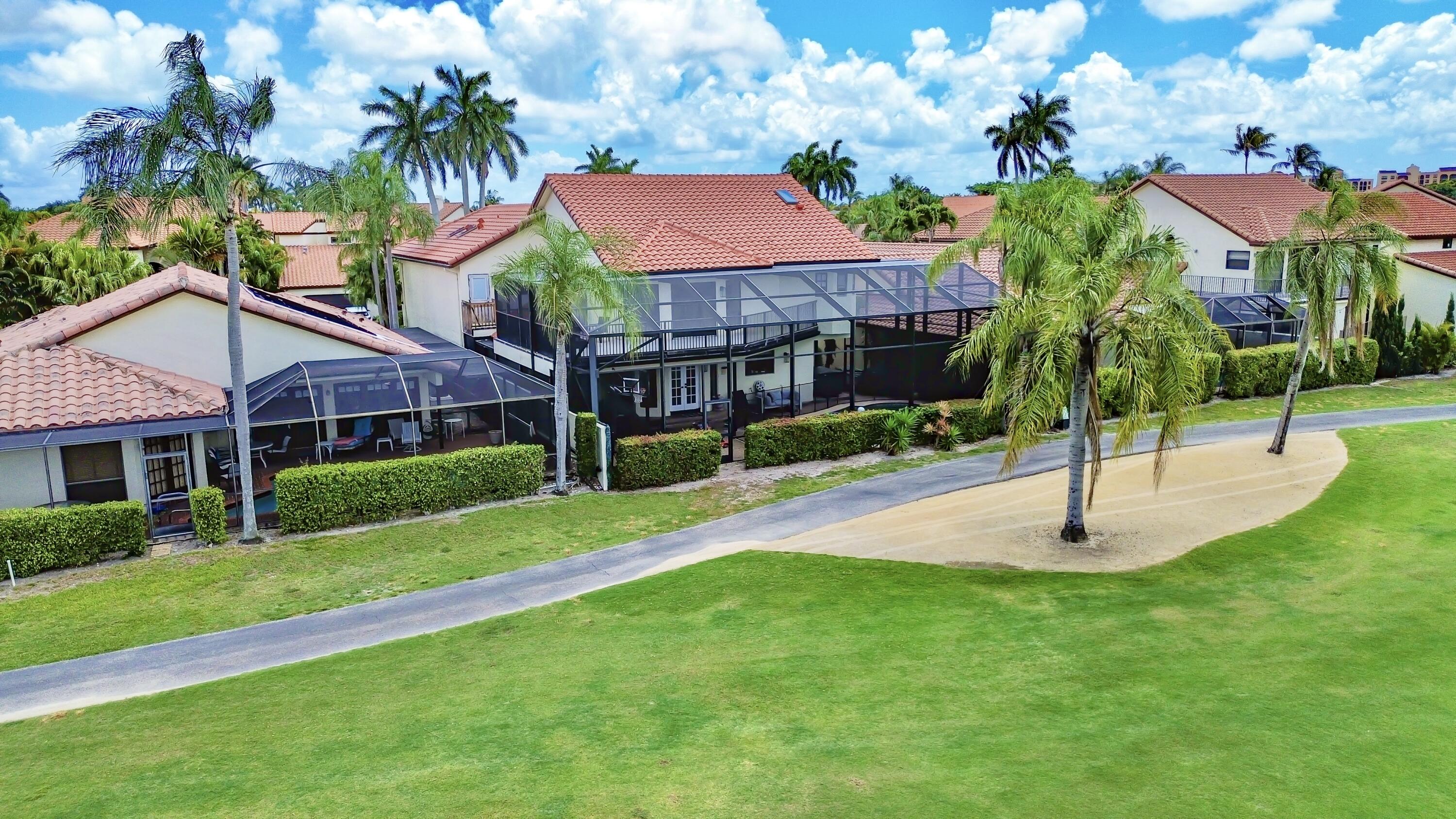 22568 Esplanada Circle Boca Raton, FL 33433 - Photo 49 of 50 a house with garden in front of it