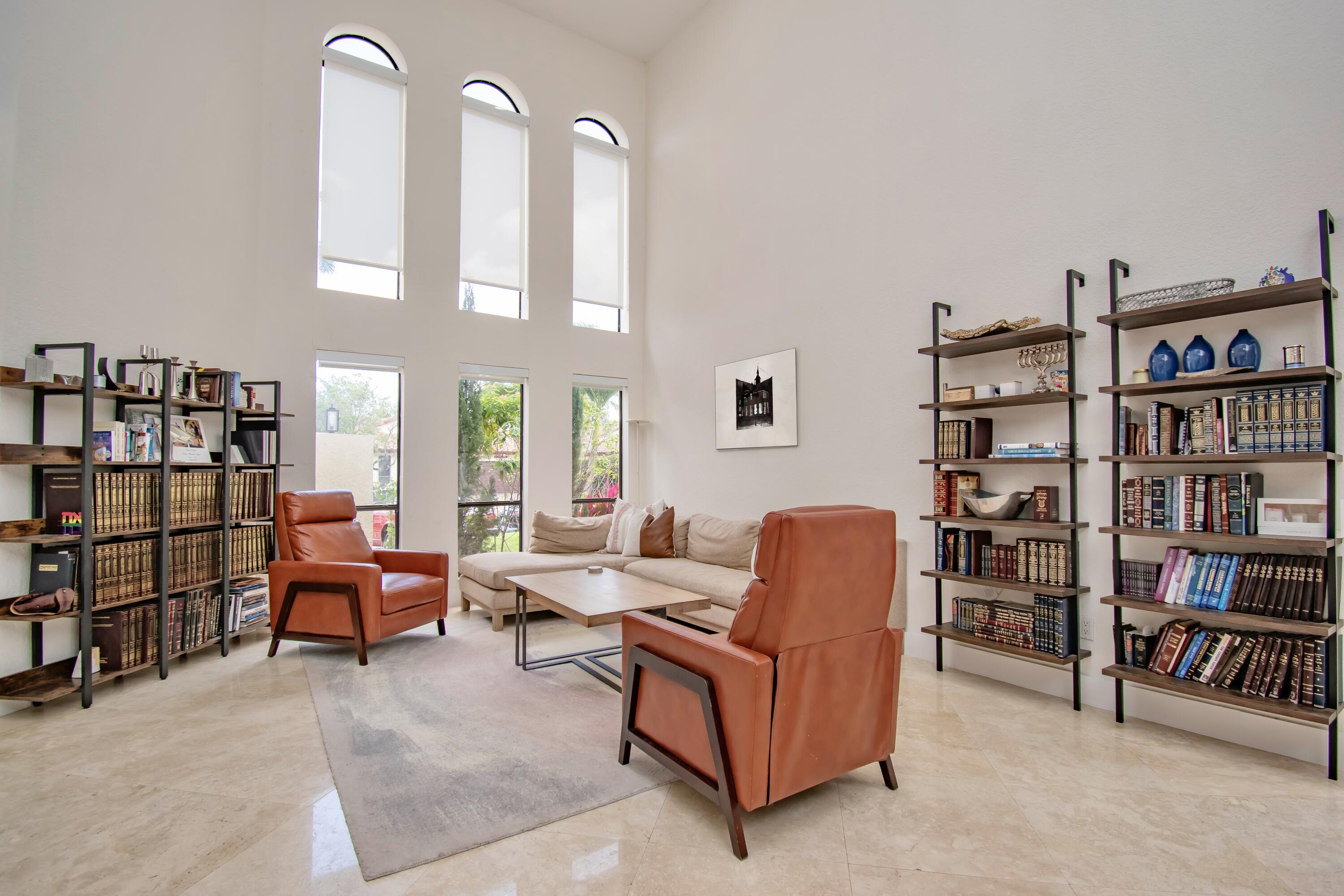 22568 Esplanada Circle Boca Raton, FL 33433 - Photo 5 of 50 a living room with furniture and a book shelf