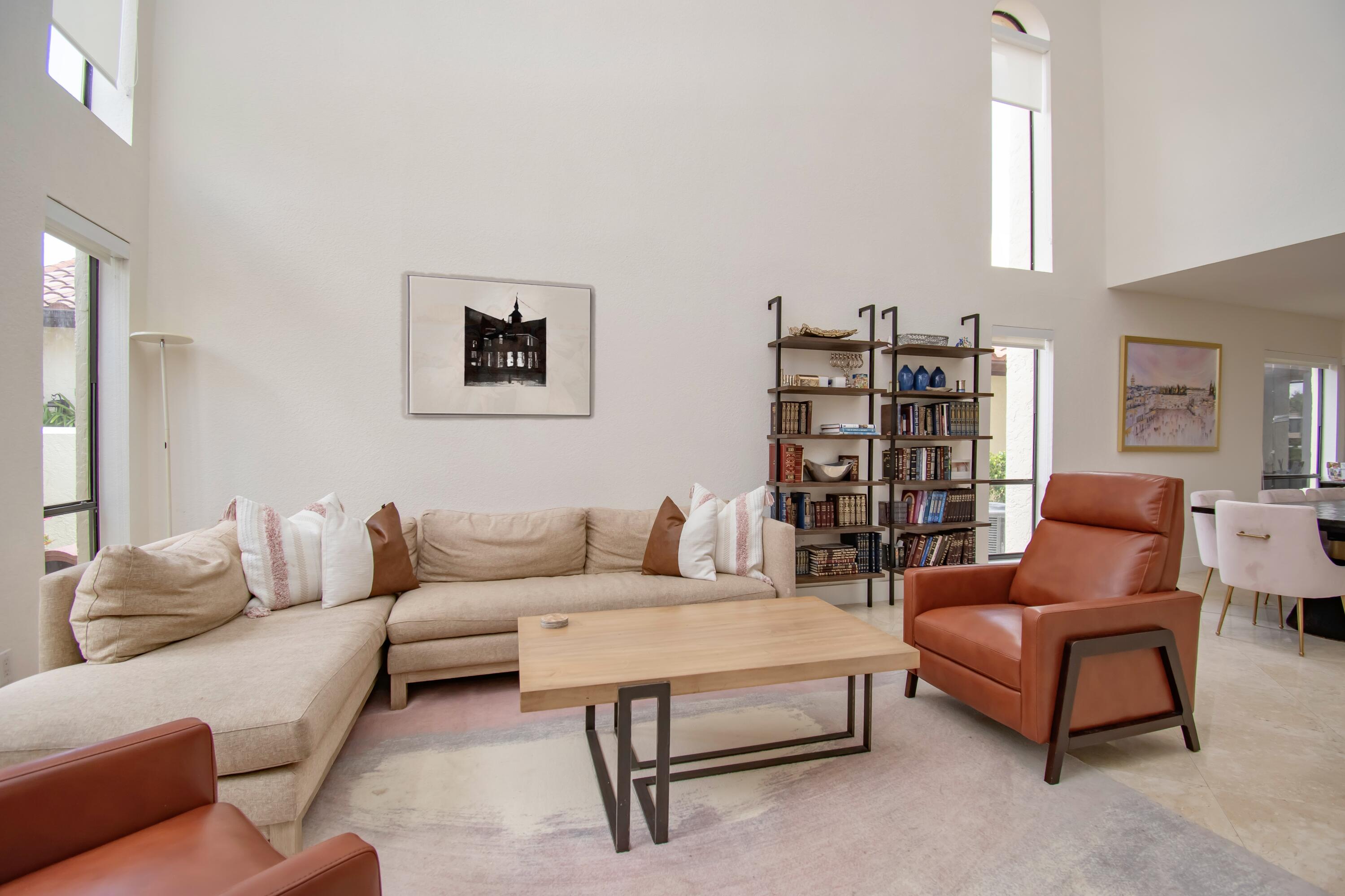22568 Esplanada Circle Boca Raton, FL 33433 - Photo 6 of 50 a living room with furniture and a book shelf