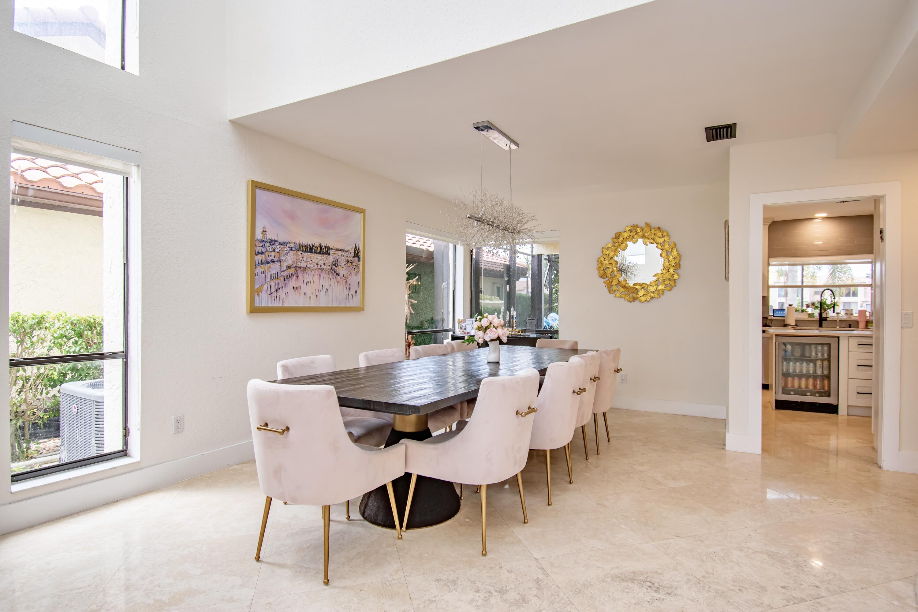 22568 Esplanada Circle Boca Raton, FL 33433 - Photo 10 of 50 a view of a dining room with furniture and a large window