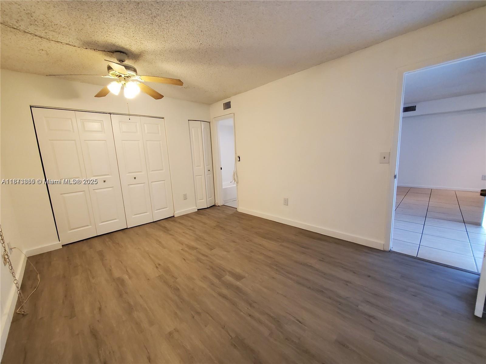 1017 Washington Circle, Unit F Homestead, FL 33034 - Photo 16 of 34 wooden floor in an empty room