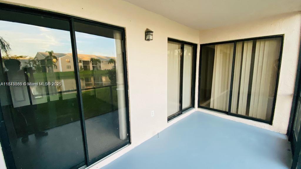 1017 Washington Circle, Unit F Homestead, FL 33034 - Photo 21 of 34 a view of a back yard from a balcony