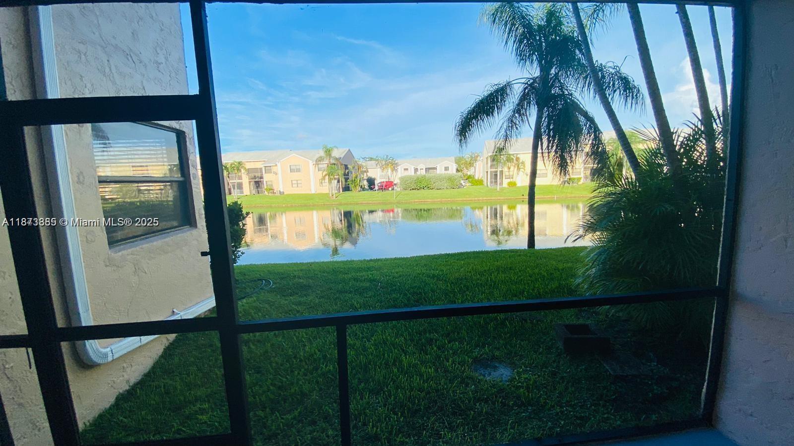1017 Washington Circle, Unit F Homestead, FL 33034 - Photo 24 of 34 a view of swimming pool from a balcony