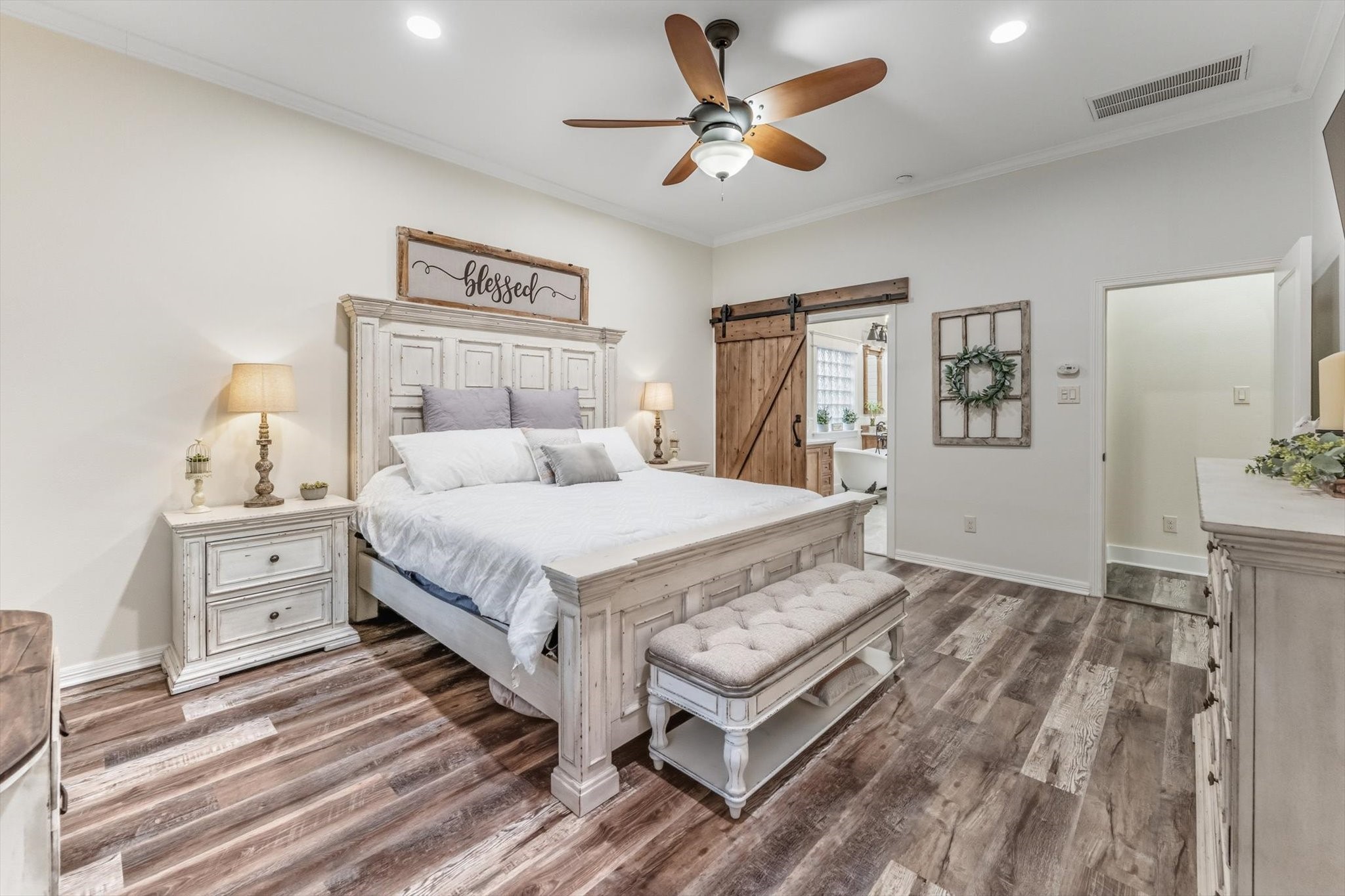 103 Fox Rindle Road Montgomery, TX 77316 - Photo 14 of 44 The tranquil primary bedroom offers generous proportions and abundant natural light, creating a peaceful space designed for rest and relaxation.
