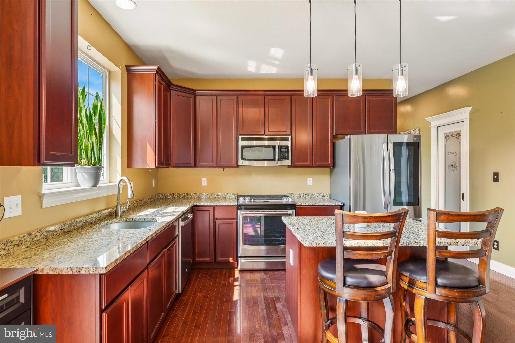 70 Alexandrea Circle Harleysville, PA 19438 - Photo 15 of 46 Modern kitchen with rich wood tones.