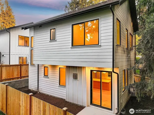 a view of a house with large windows