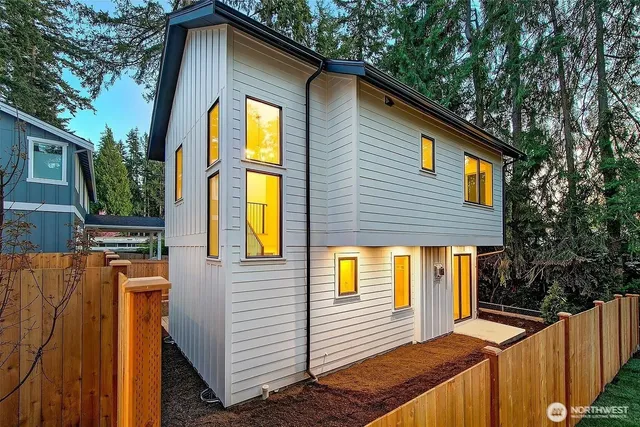 a view of a house with large windows