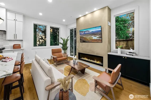 a work room with furniture and a flat screen tv