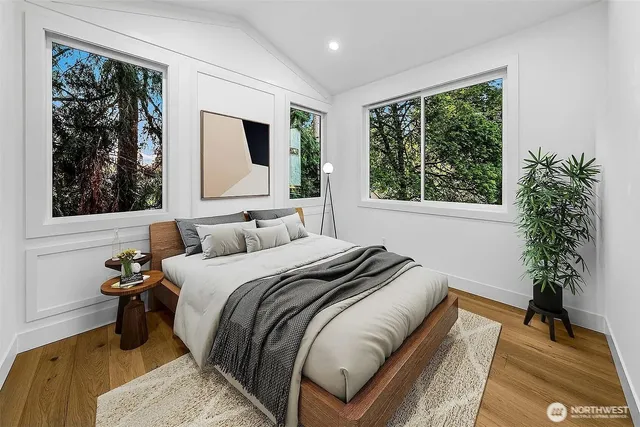 a bedroom with bed and a window