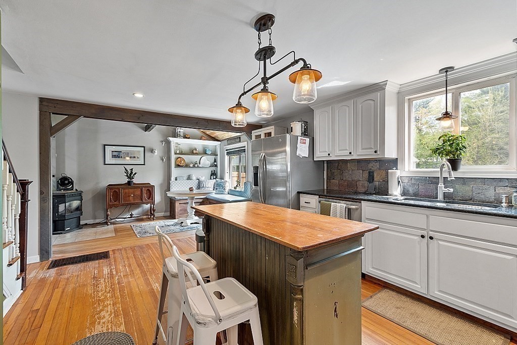131 Lawrence Road Haverhill, MA 01835 - Photo 11 of 39 a kitchen with stainless steel appliances granite countertop a sink and a stove