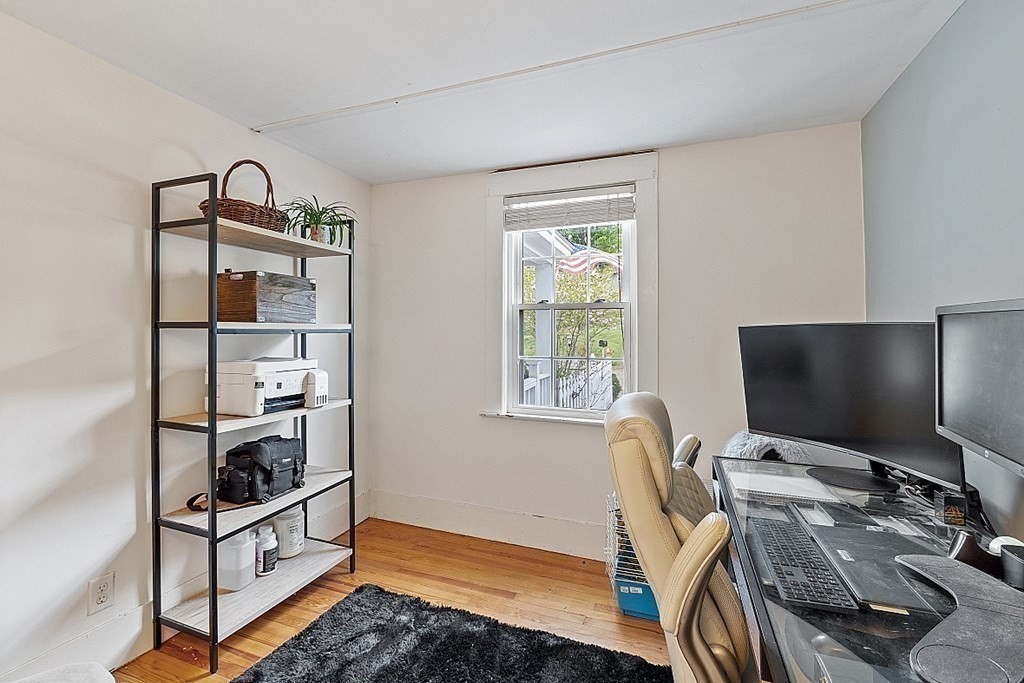 131 Lawrence Road Haverhill, MA 01835 - Photo 17 of 39 a view of a workspace with furniture and a window