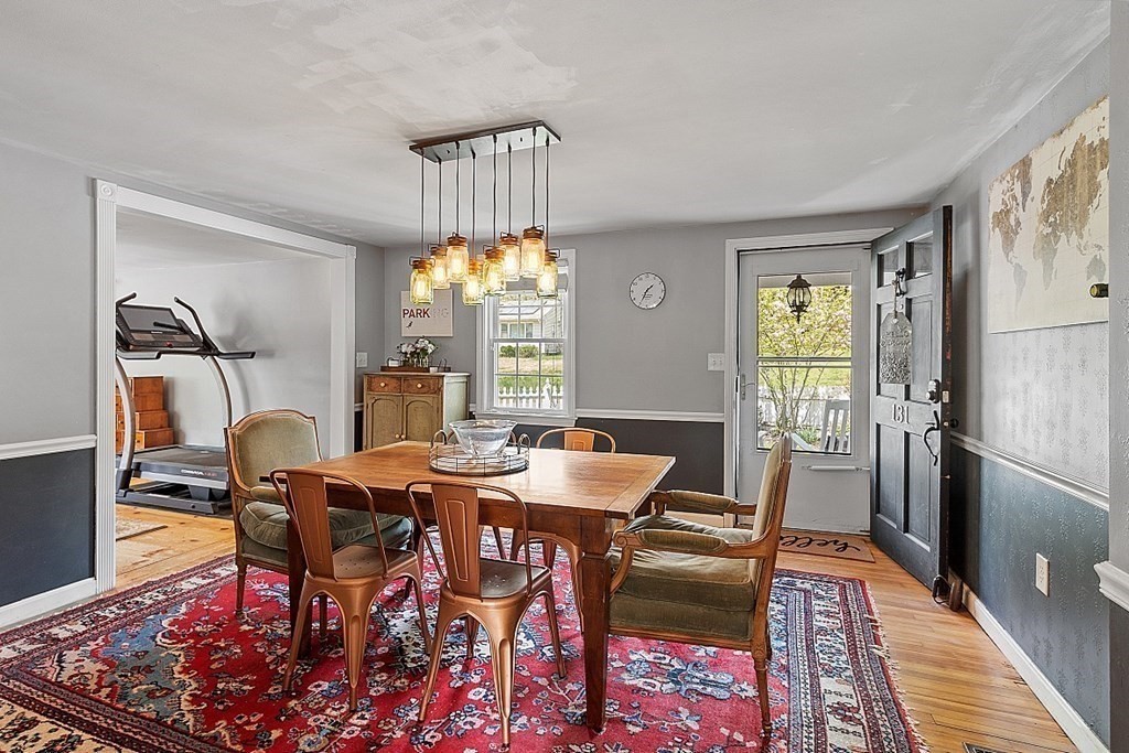 131 Lawrence Road Haverhill, MA 01835 - Photo 18 of 39 a view of a dining room with furniture window and wooden floor